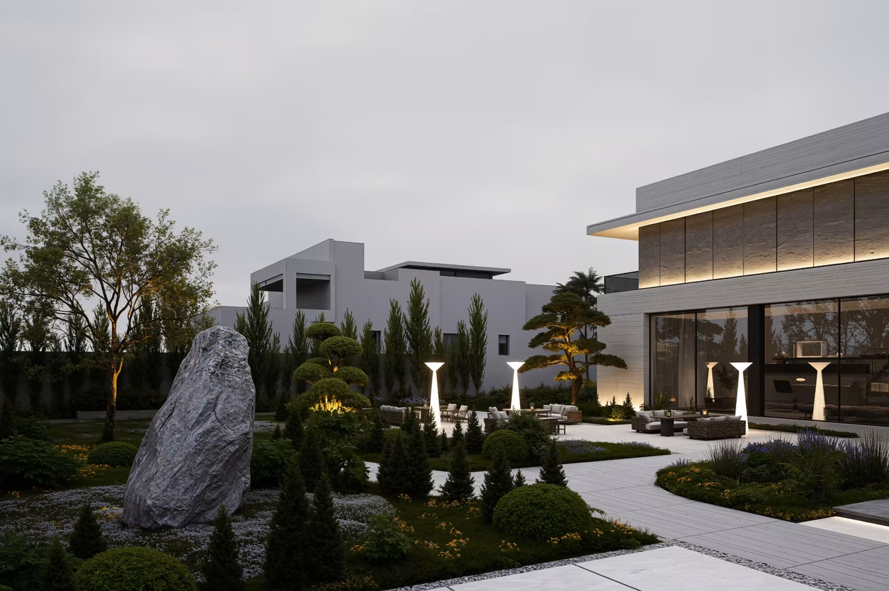 Landscape garden with sculpted rock, planted paths and evening garden lighting